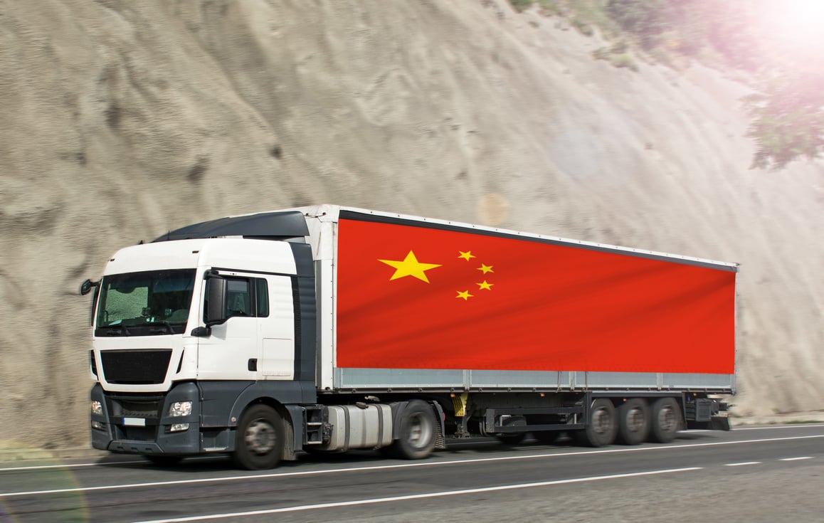 Truck carrying goods. Import of products from China- concept.