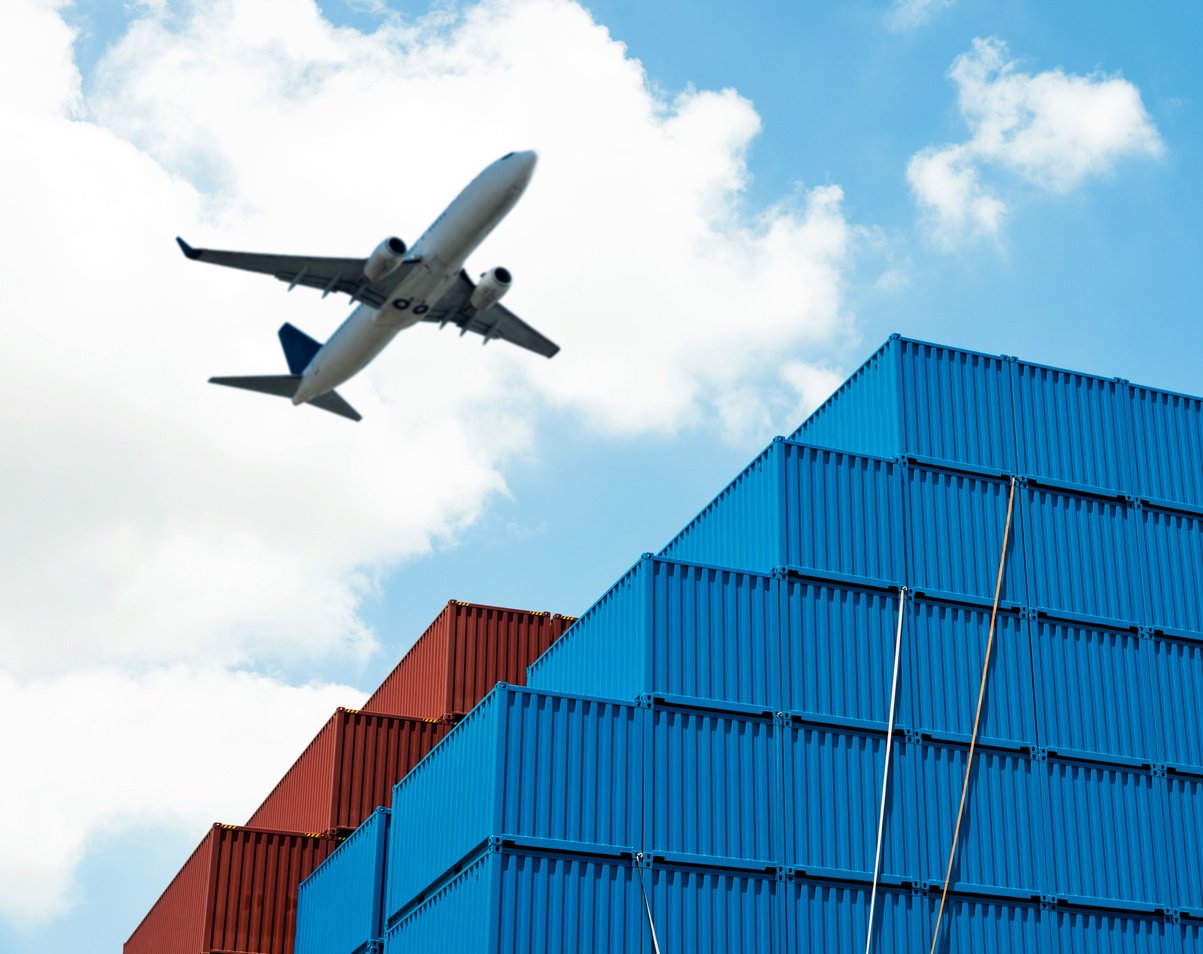 Air freight and stack of cargo containers at the docks